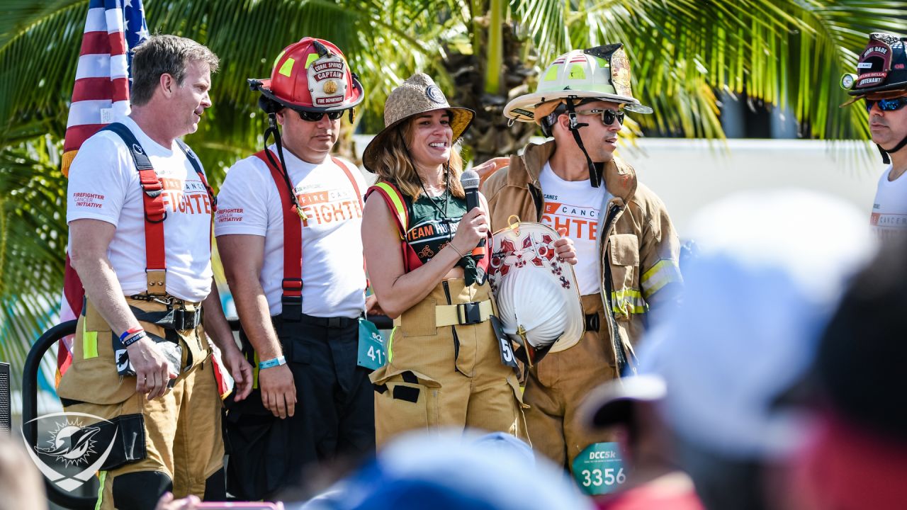 Four male and one female firefighter
