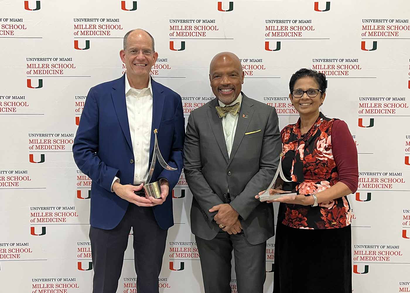 Dean Ford poses with award winners