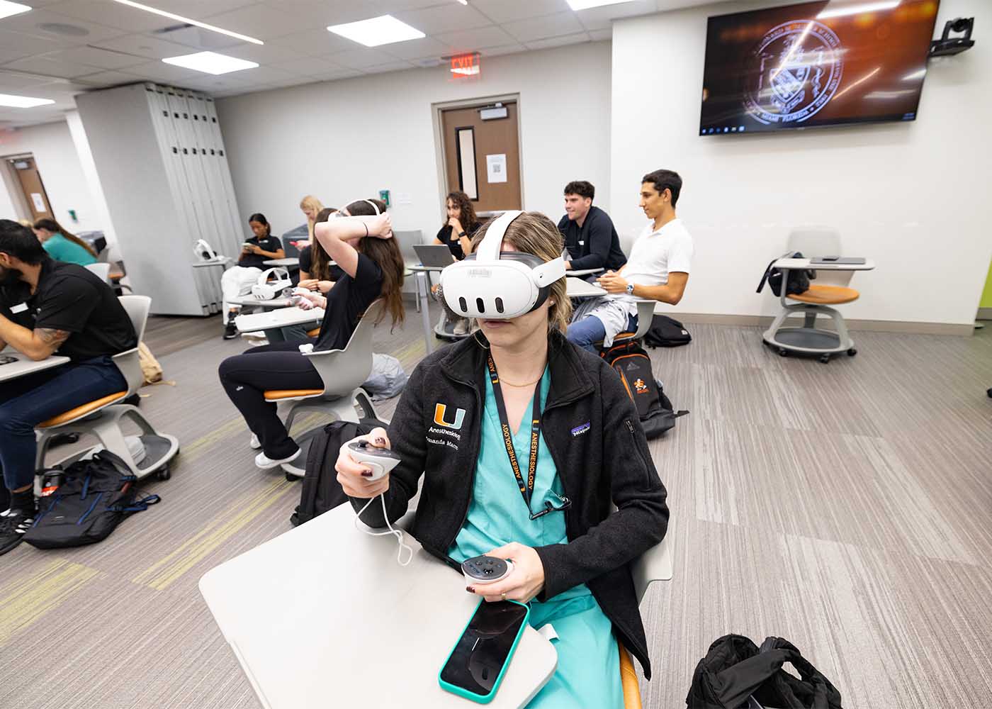 medical student interacts with a virtual environment using vr goggles