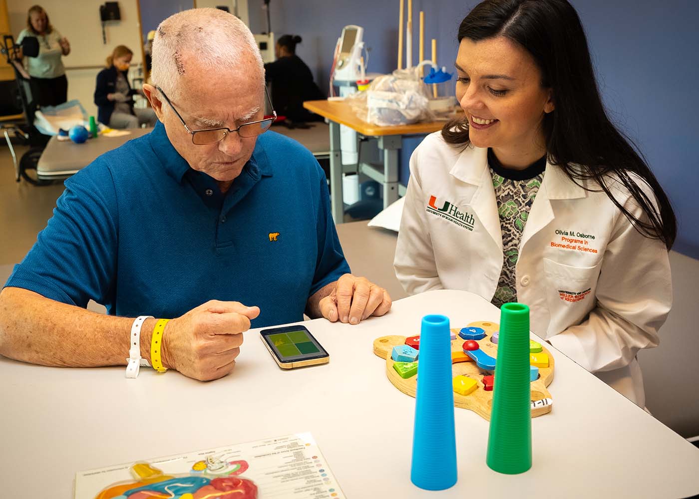 Olivia Osborne working with a patient