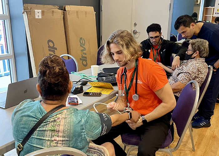 Physician working with patients at a pop up clinic