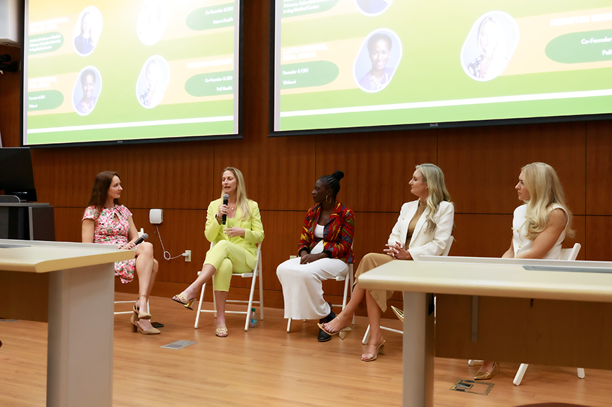 5 female panelists conversing