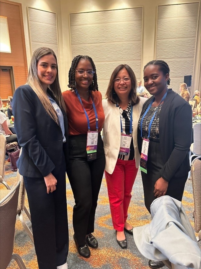 Four Senior Tozman Scholars standing together