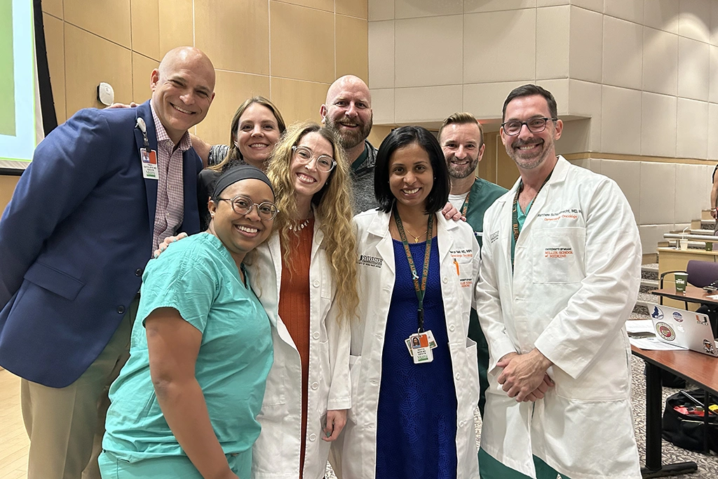 Group of physicians pose for a photo