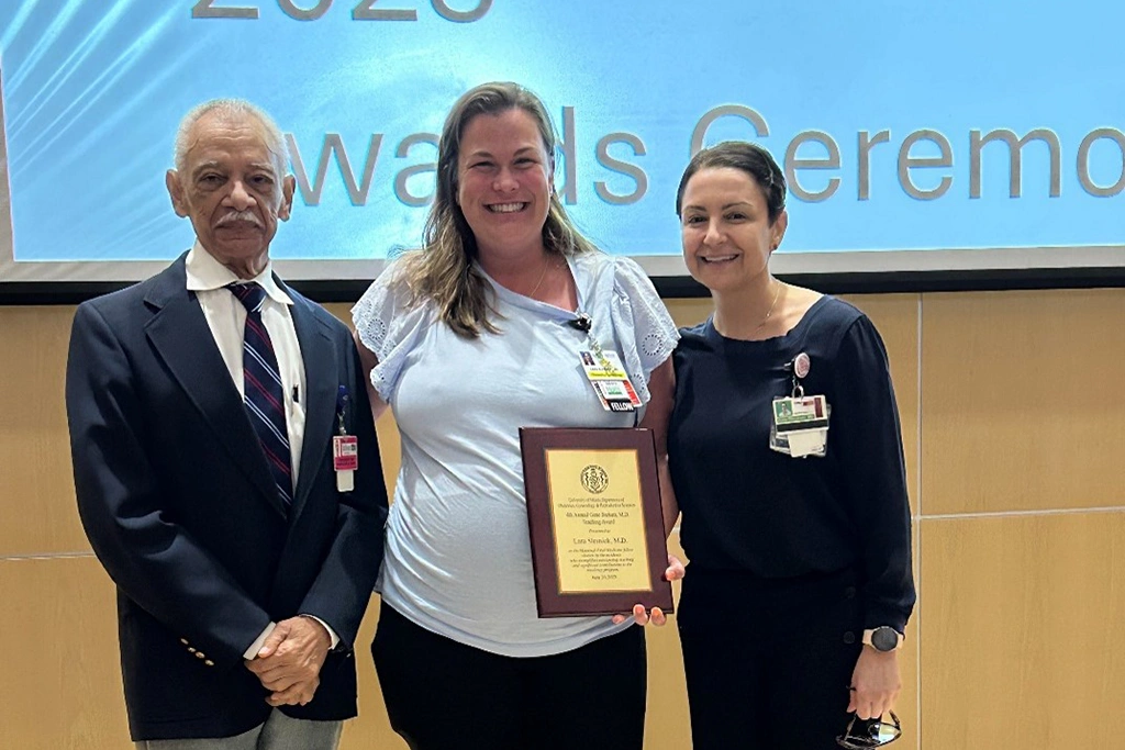 Group of people pose at an event