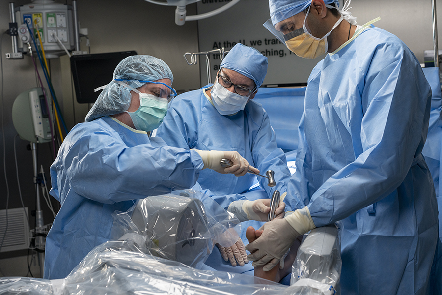 Surgeons performing a procedure on a patient