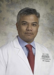 Headshot of Doctor JJ Karmacharya