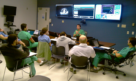 Group of surgeons discuss a patient's files