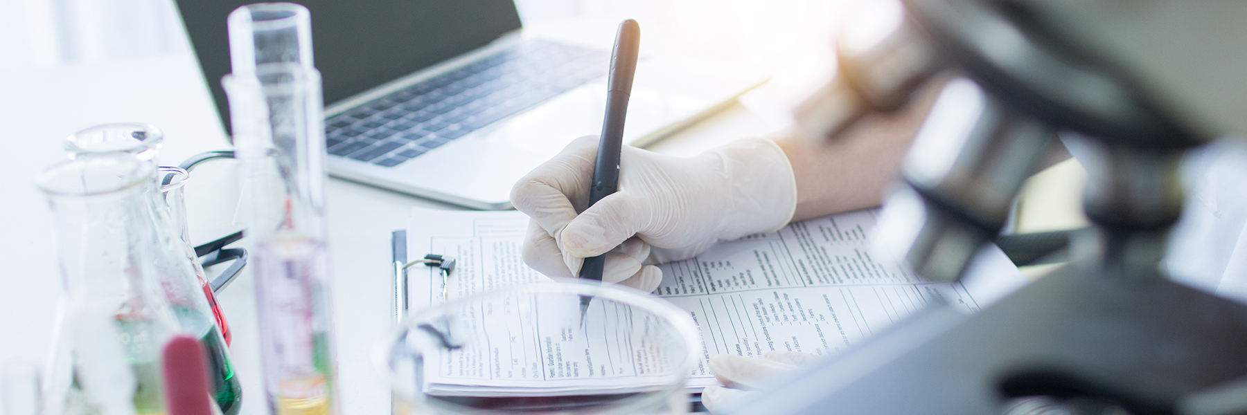 A lab technician is taking notes
