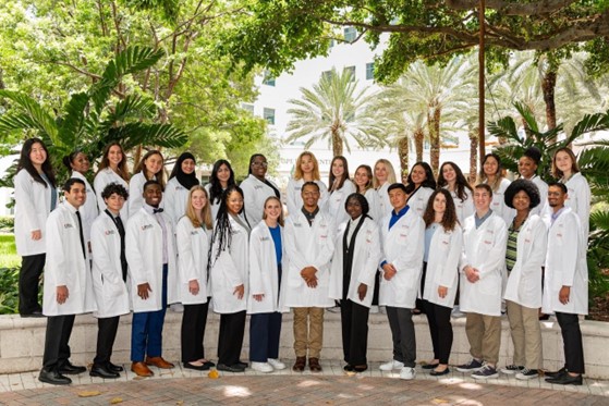 Summer students in white coats