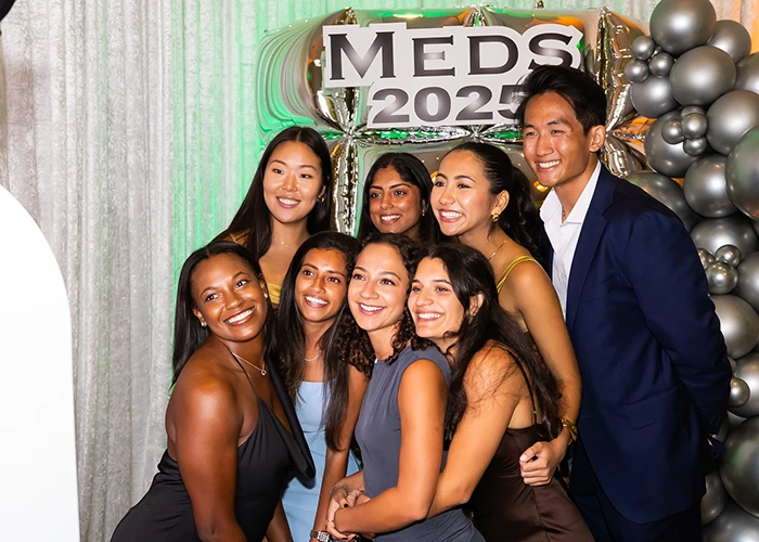 group of med school students posing for a photo at an event