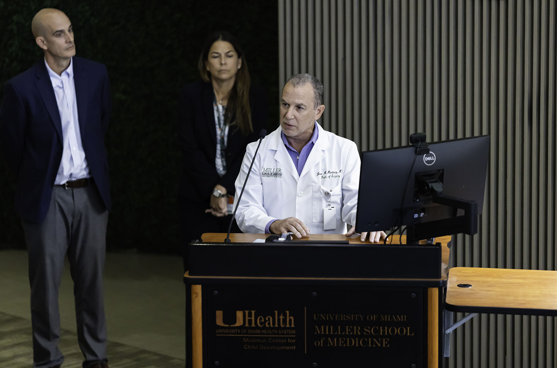 medical education administrator speaking at podium