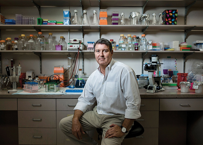 scientist poses in laboratory