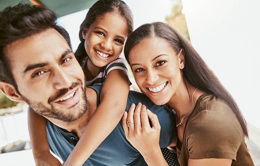 smiling happy family pose for a photo