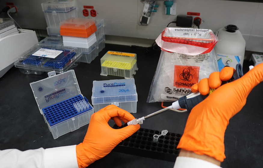 researcher working with hazardous materials in a lab