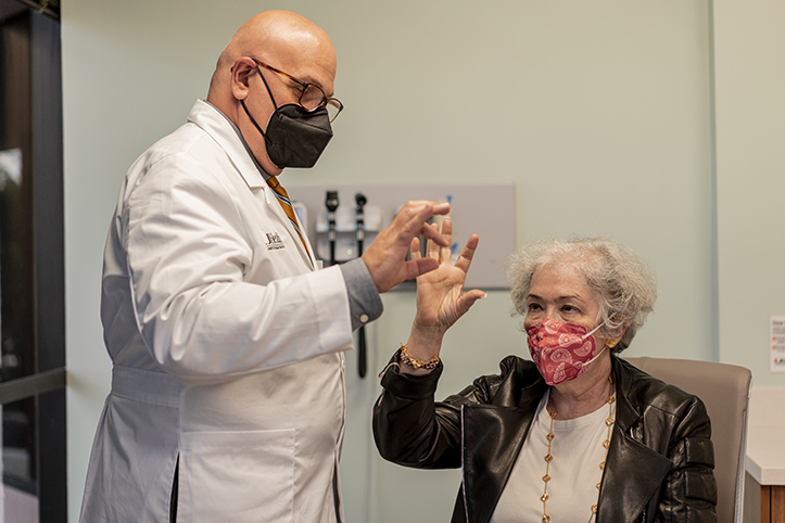 Doctor and patient doing tests with hands