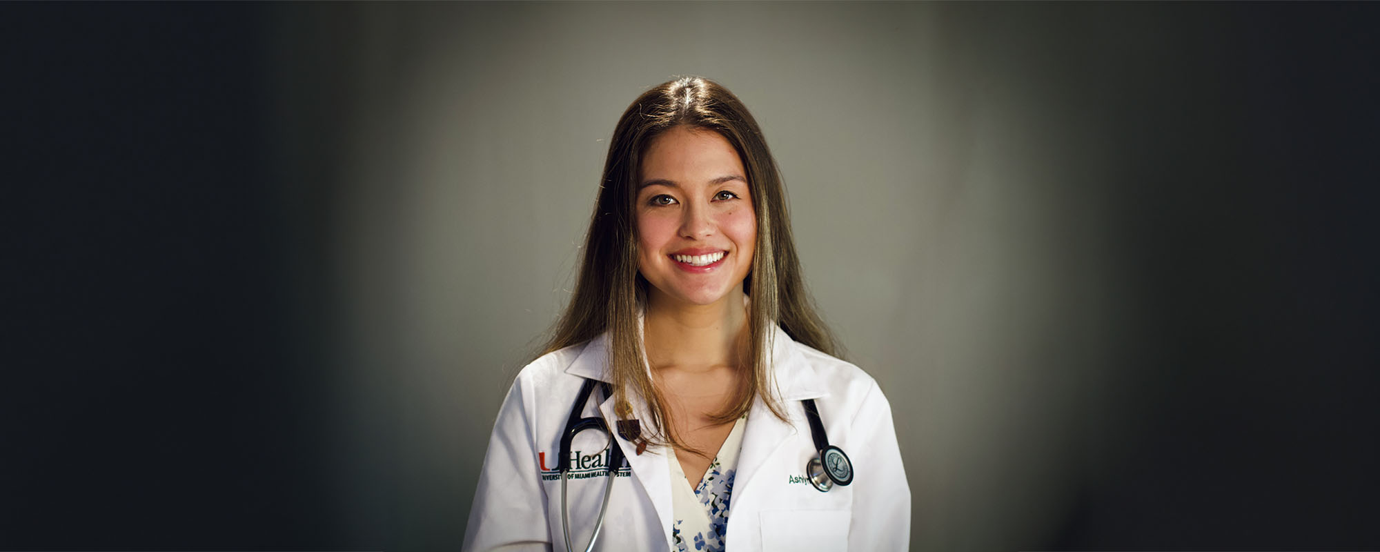 Medical student Ashlyn Anzu Gary in white clinic coat