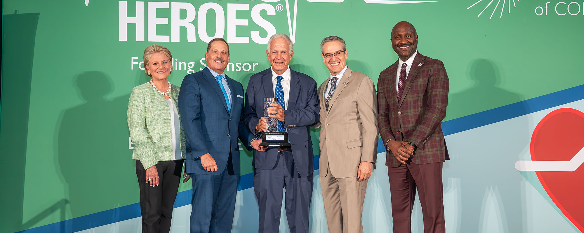 Dr. William Culbertson at the Health Care Heroes award presentation, with members of the Greater Miami Chamber of Commerce