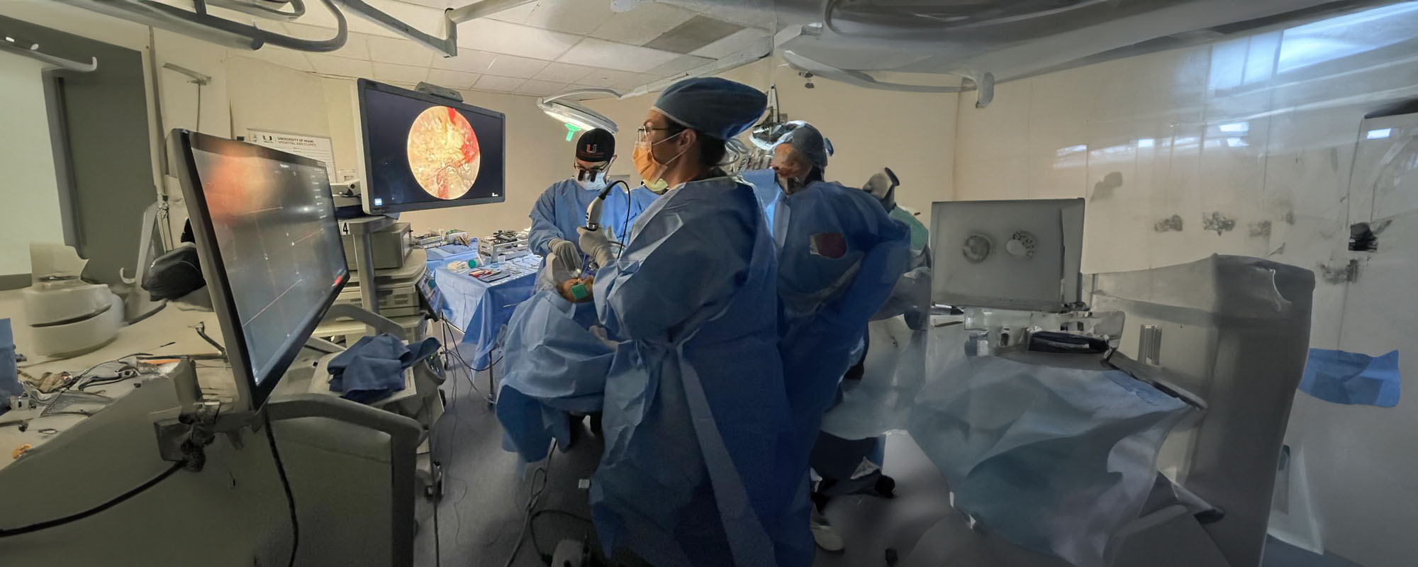 UHealth surgeons performing removal of a tumor near a patient's eye