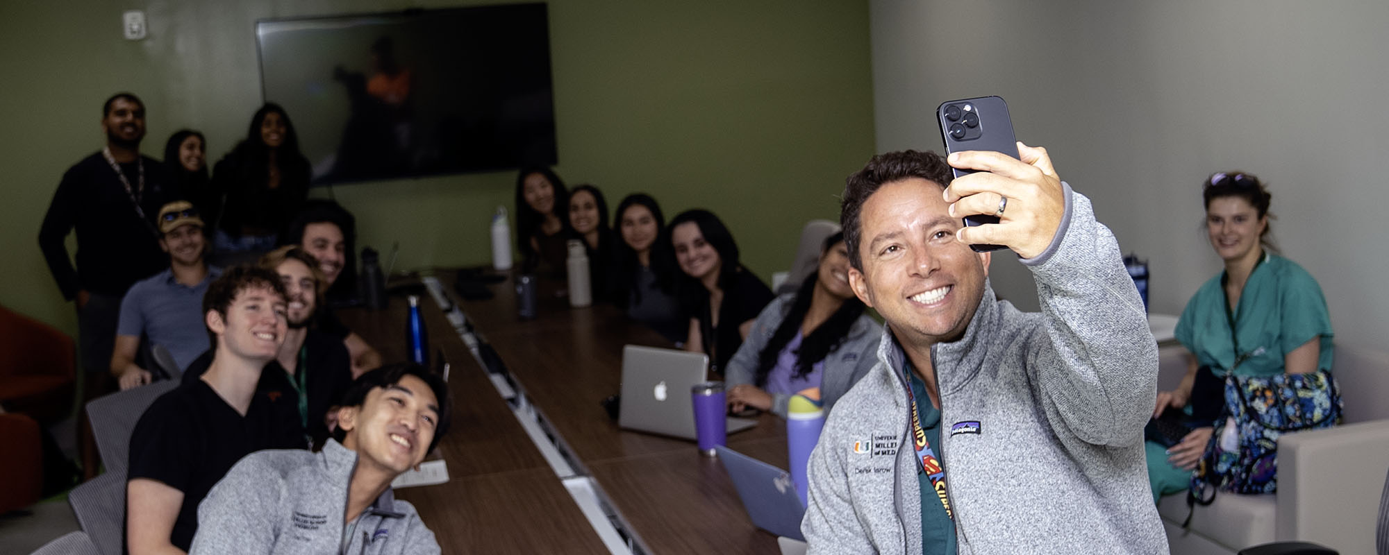 Dr. Derek Isrow taking a selfie with his medical student mentees