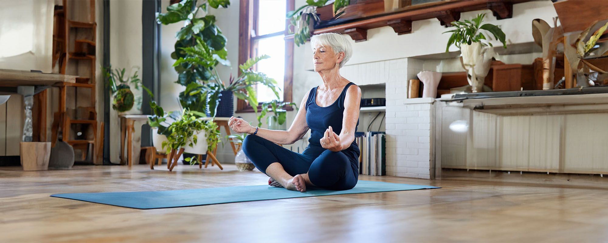 Older woman in leotard in the lotus position