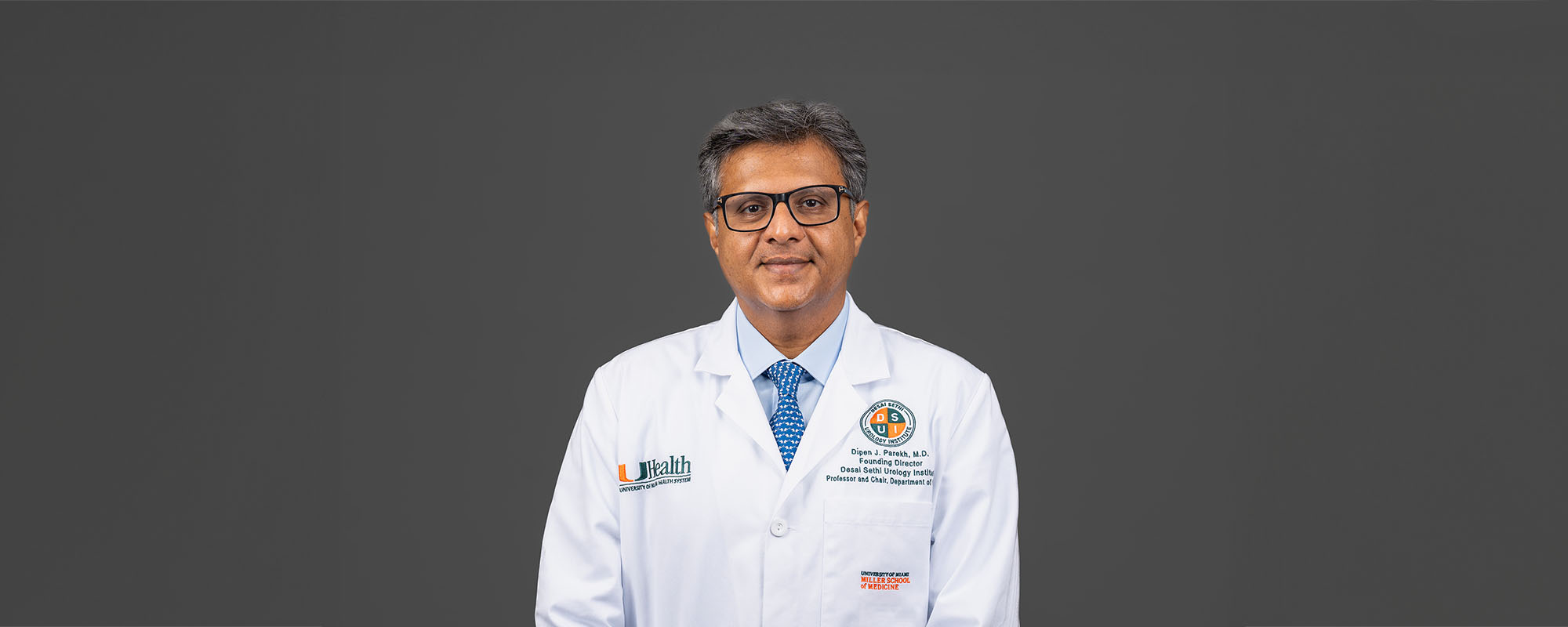 Dr. Dipen Parekh in white clinic coat