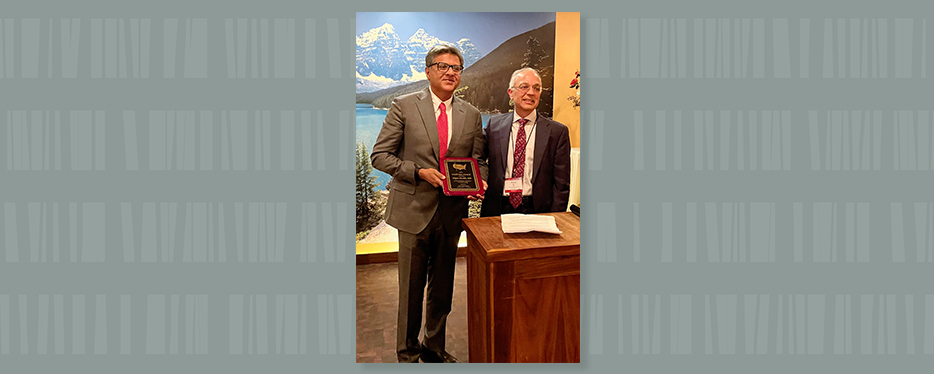 Dr. Parekh, holding Sushruta Award plaque, with Dr. Anurag Das, president of the IAUA